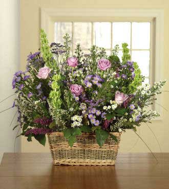 Roses, Bells of Ireland and Purple Monte Cassino Spray Aster in Basket